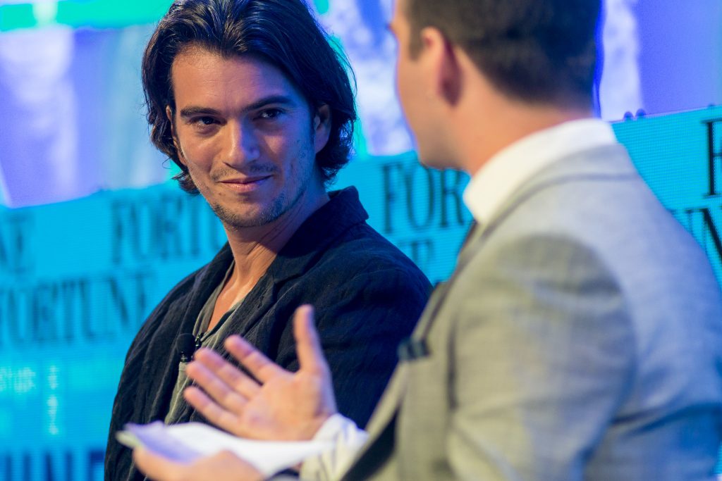 Adam Neumann at a conference